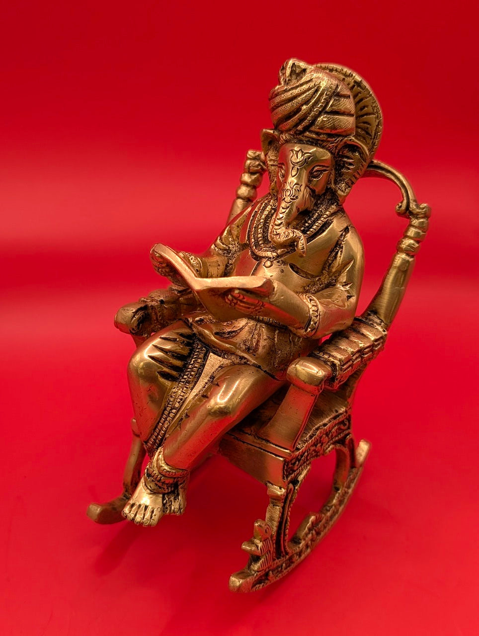 Unique Brass Ganesha on Rocking Chair with Book – Divine Wisdom