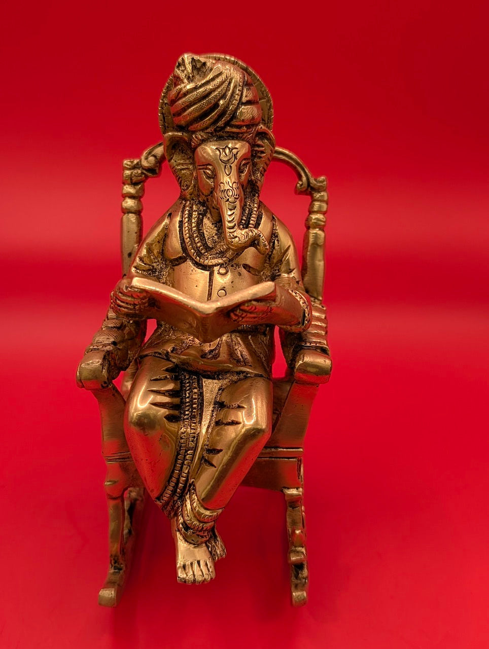Unique Brass Ganesha on Rocking Chair with Book – Divine Wisdom
