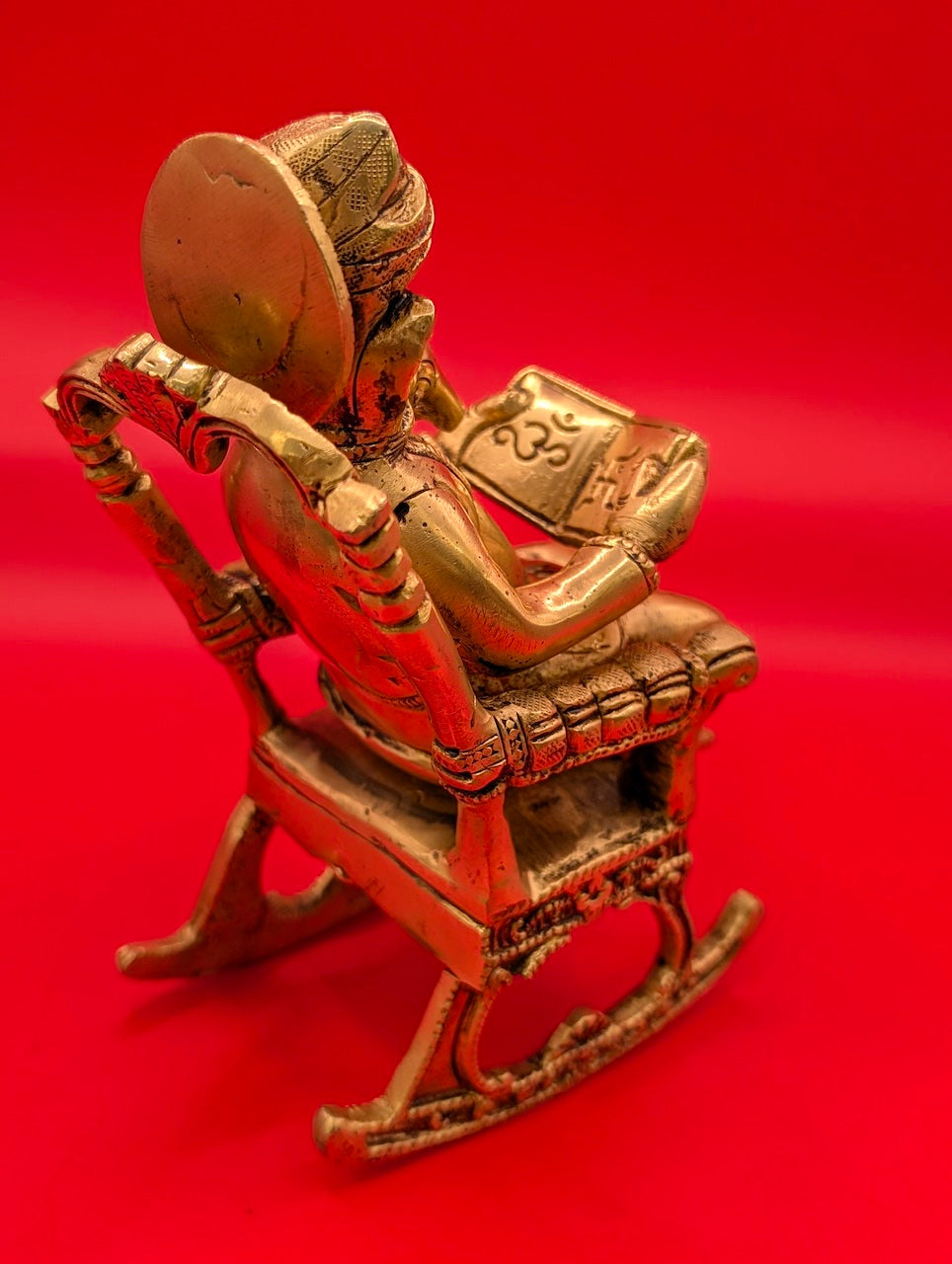 Unique Brass Ganesha on Rocking Chair with Book – Divine Wisdom