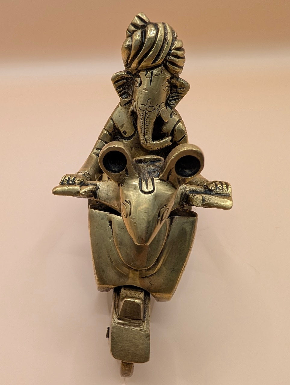 Antique Finish Ganesh on Scooter – Divine Decor with Swag