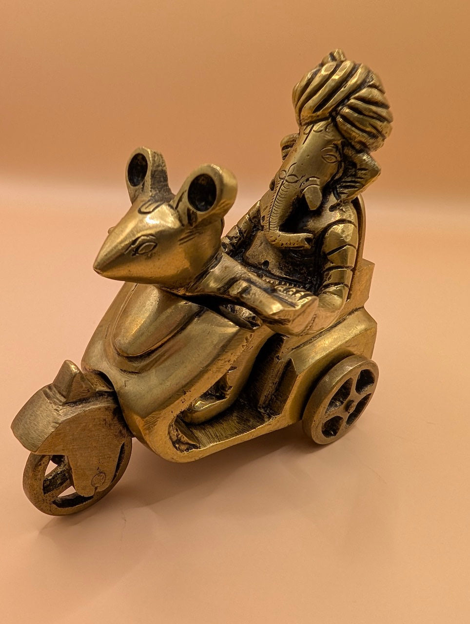 Antique Finish Ganesh on Scooter – Divine Decor with Swag